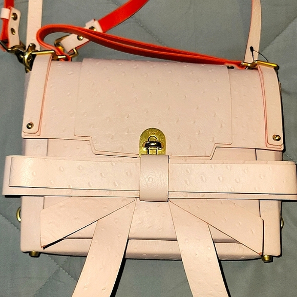 Niels Peeraer Chic Pink Crossbody Bag with Detachable Straps And Bow Detail